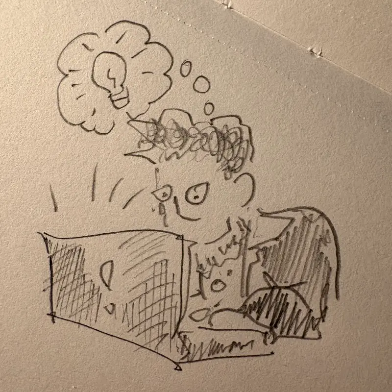 Cartoon of Shannon with his laptop, having an idea lightbulb over his head